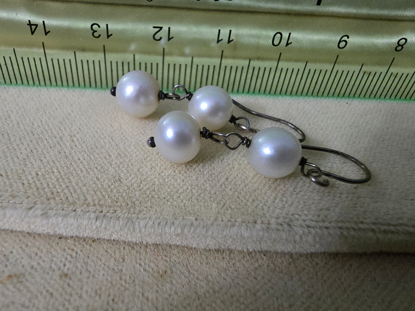 Double drop freshwater pearl earrings using stylish twisted wire effect, the largest pearl is 7mm