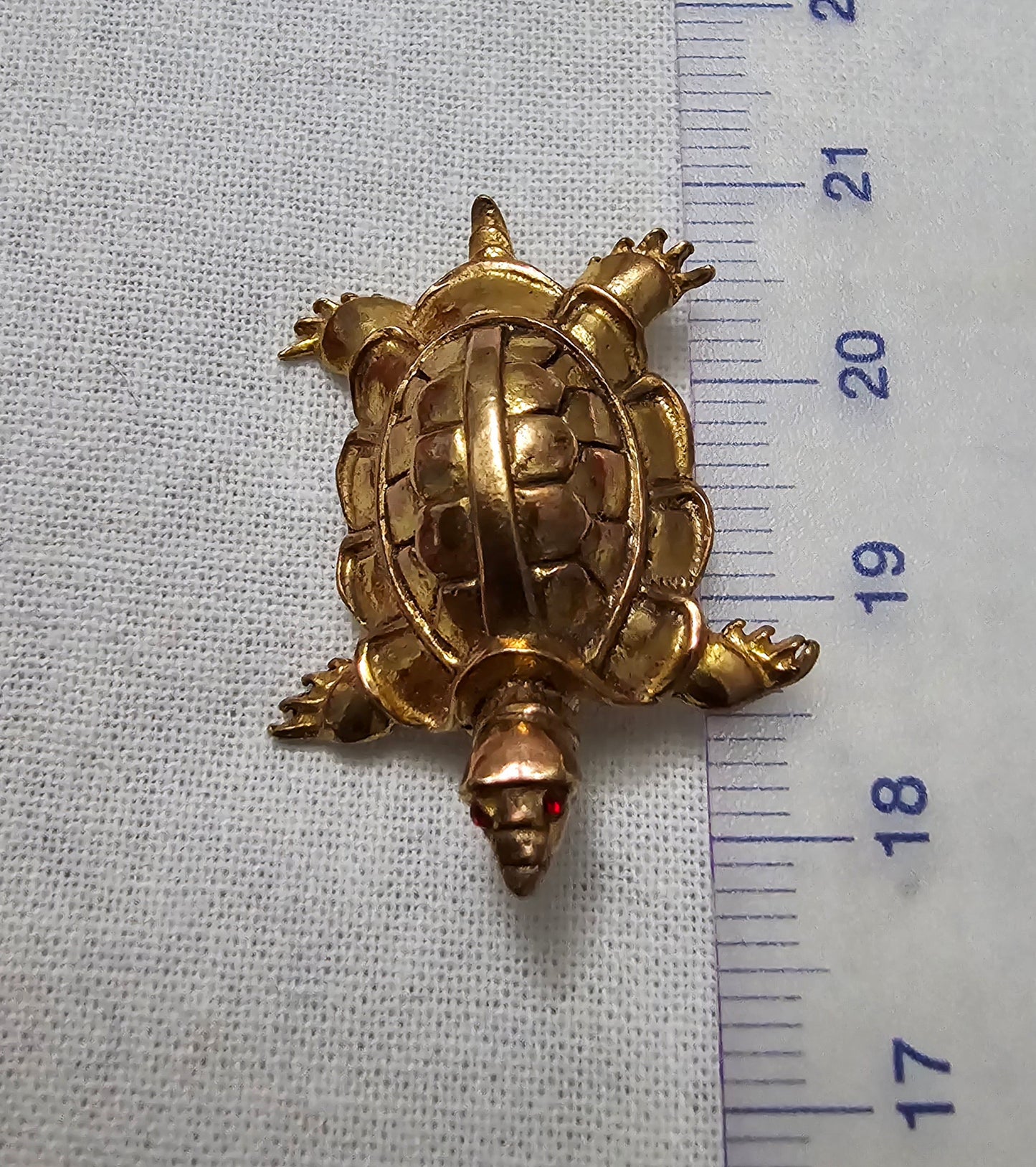 Vintage gold turtle brooch with small red crystal eyes