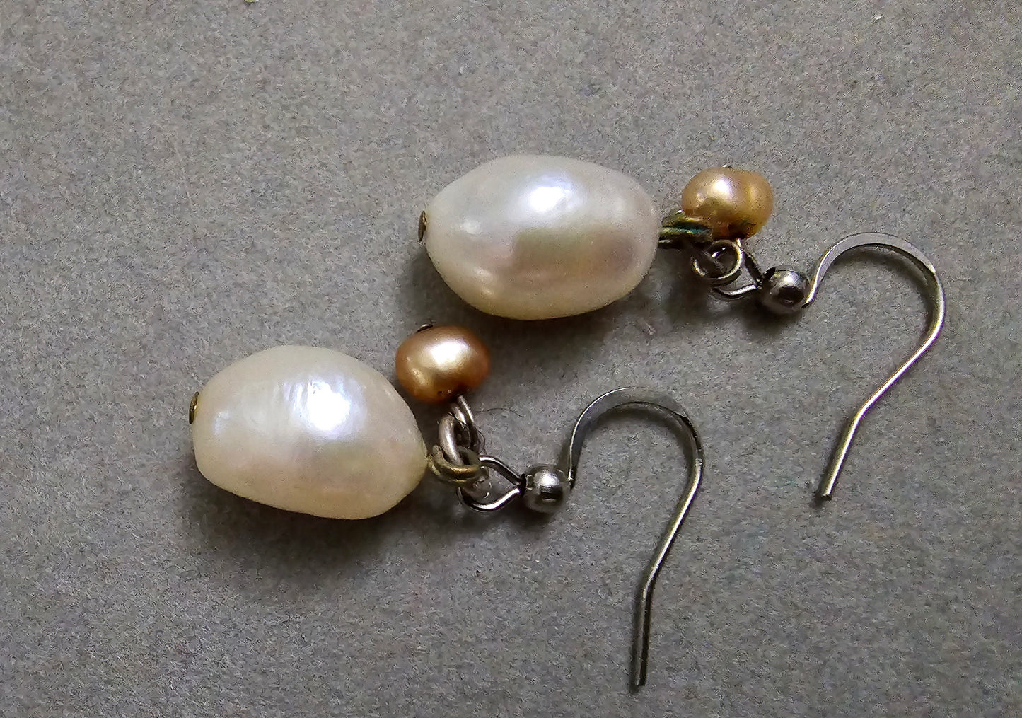 Large (approx 15mm long) white cultured pearl earrings with a tiny copper accent bead.