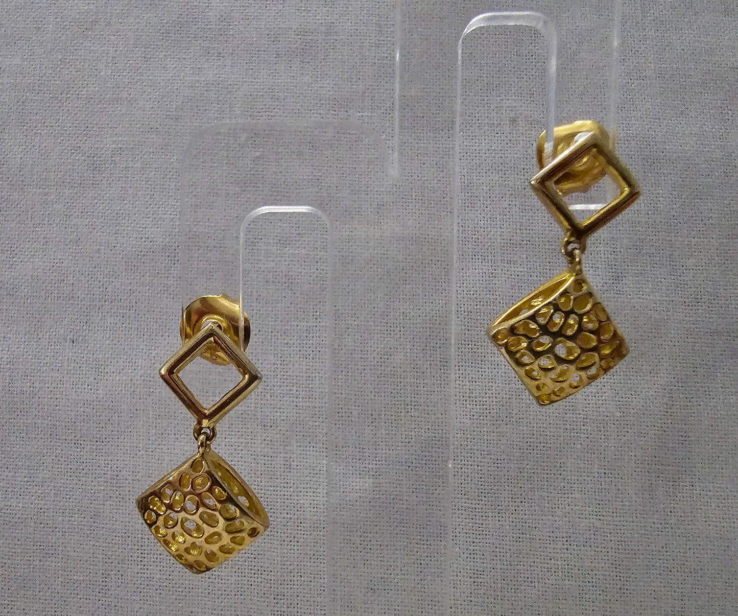 Gold on silver open weave offset square with filligree style drop.